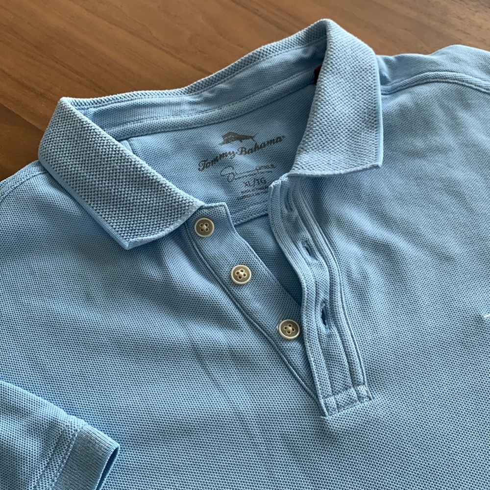 Tommy Bahama Blue Polo Shirt Classic Knit. Collar. Finished bottom. Cuff sleeve.
